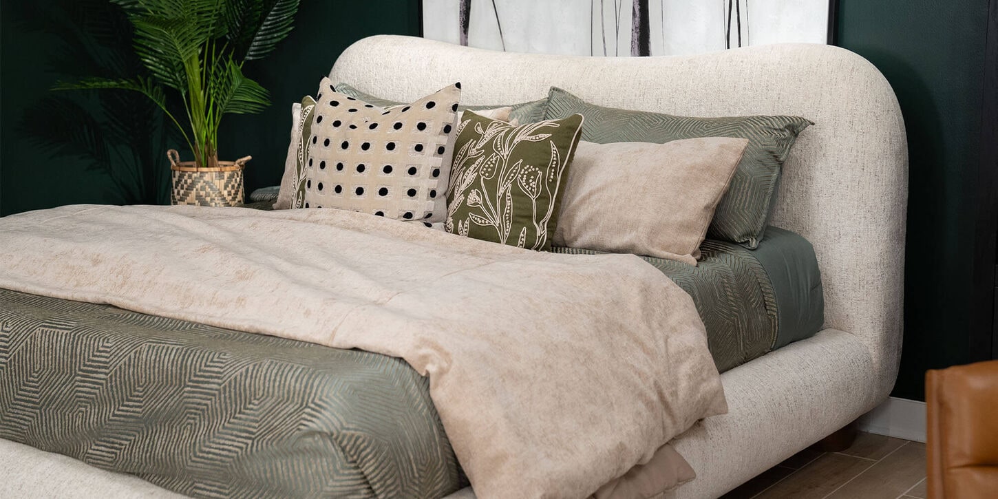 37B limited drop bed with pillows and sheets on the bed