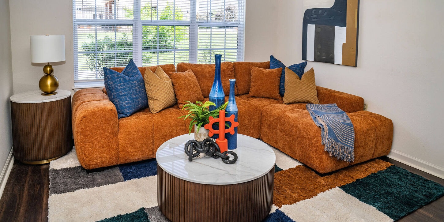 37b limited drop furniture with a rug, sofa, chair, coffee table and lamps