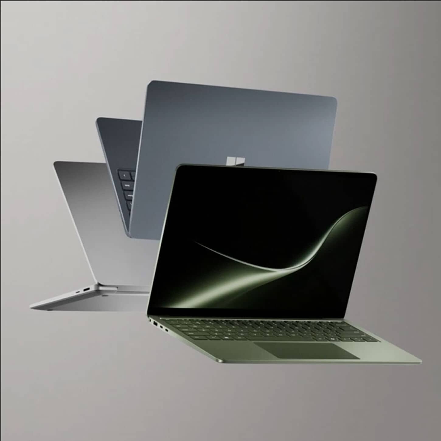 Three Microsoft computers