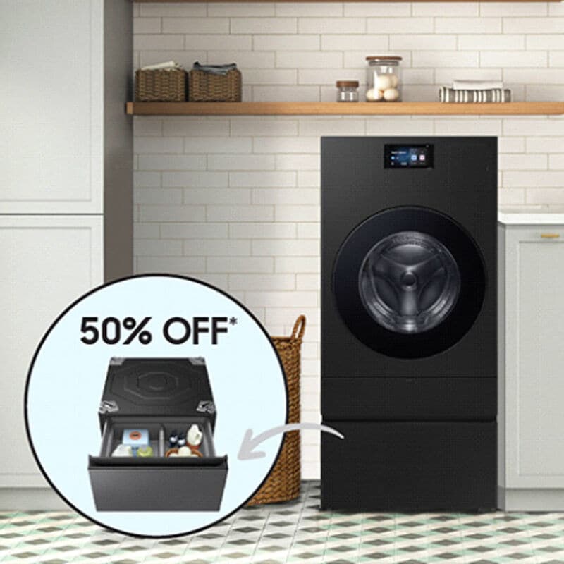 samsung combination washer and dryer in grey in laundry room with white cabinets