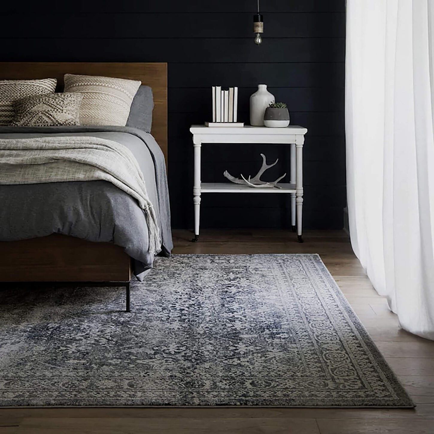 bedroom with bed and large area rug