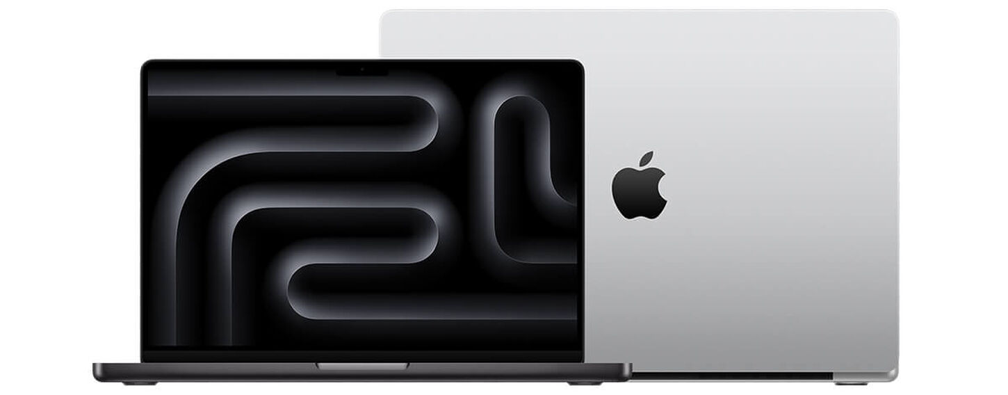 Two Apple MacBook Pros open facing opposite directions