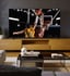 Basketball player dunking on large screen TV in a living room