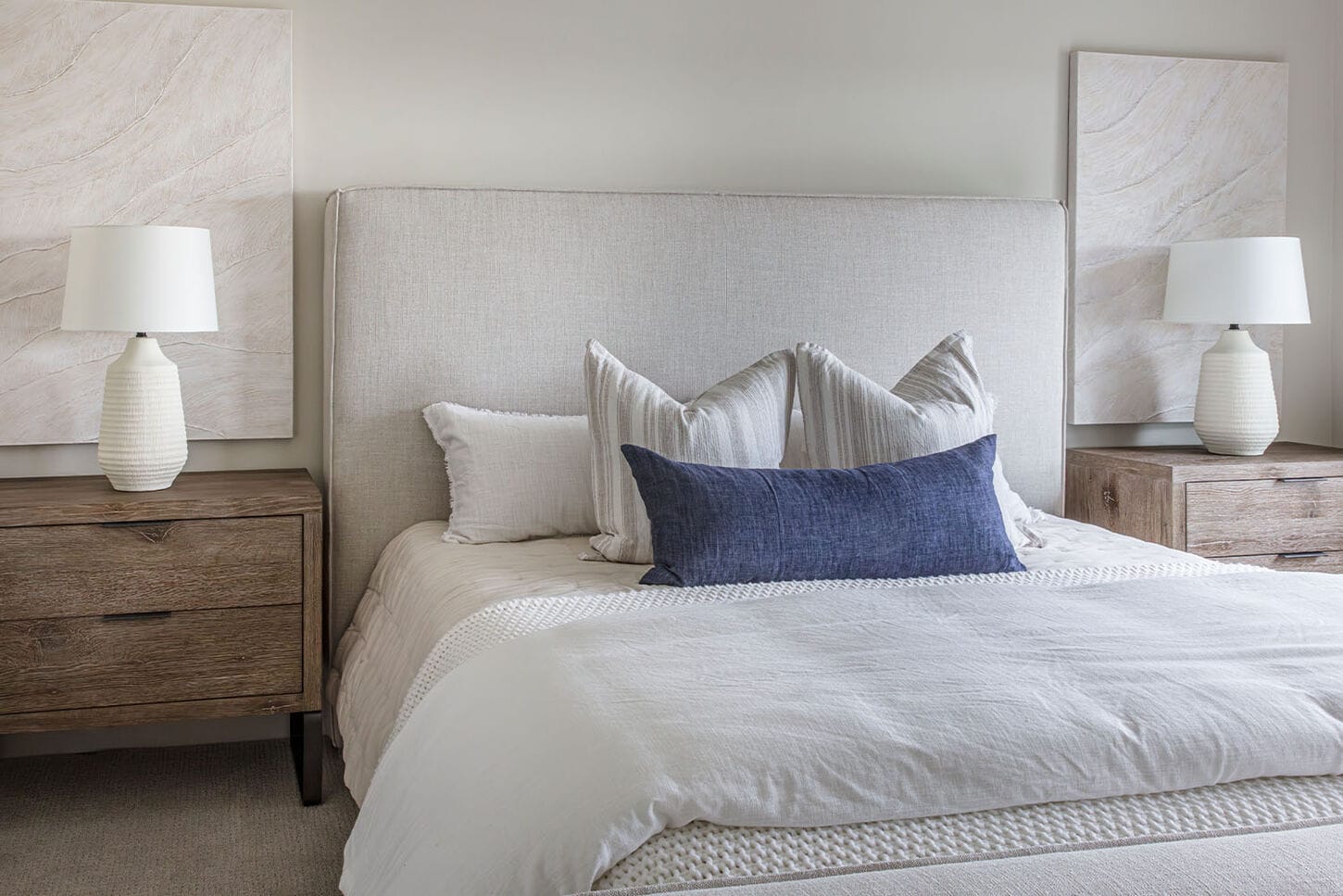 A split collage of a bedroom set up. The left side is showing a japandi themed storage cabinet and the right side is showcasing a bed with a nightstand and lamp. 