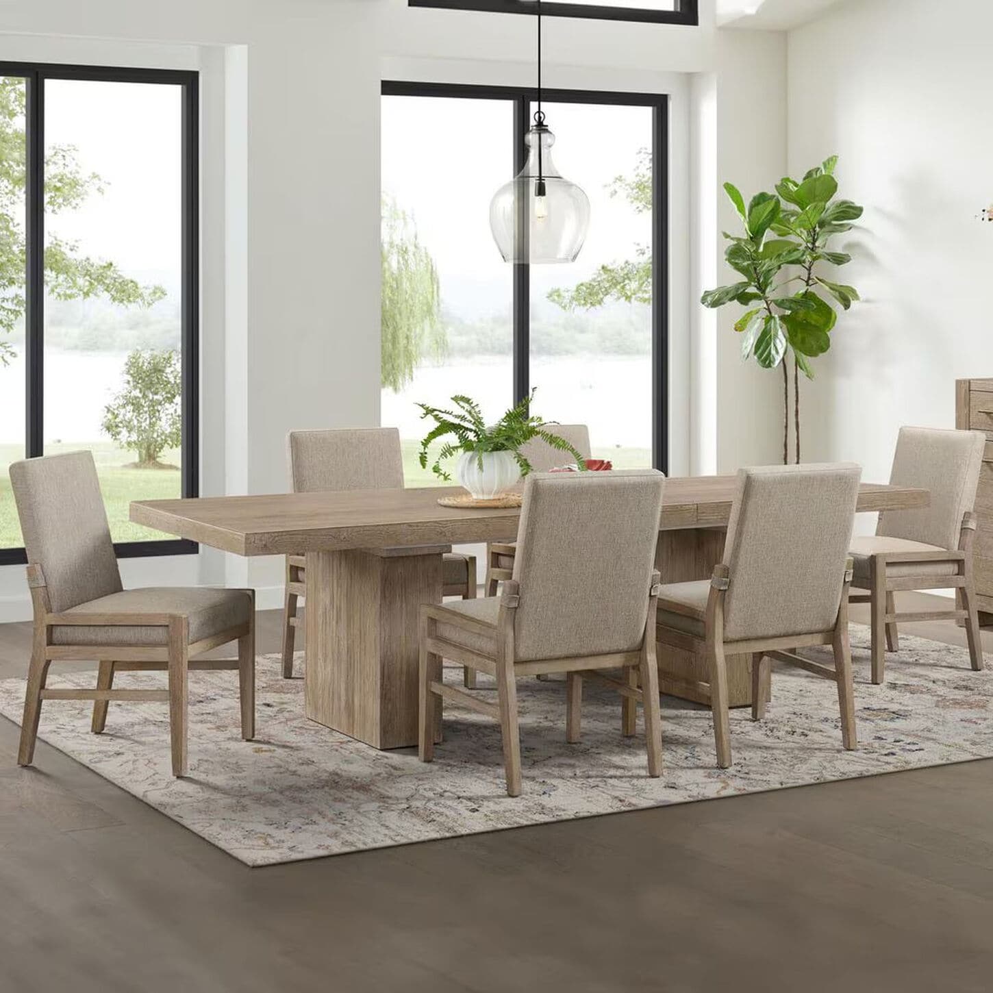 Bright dining room with black webbed dining chairs surrounding dining table