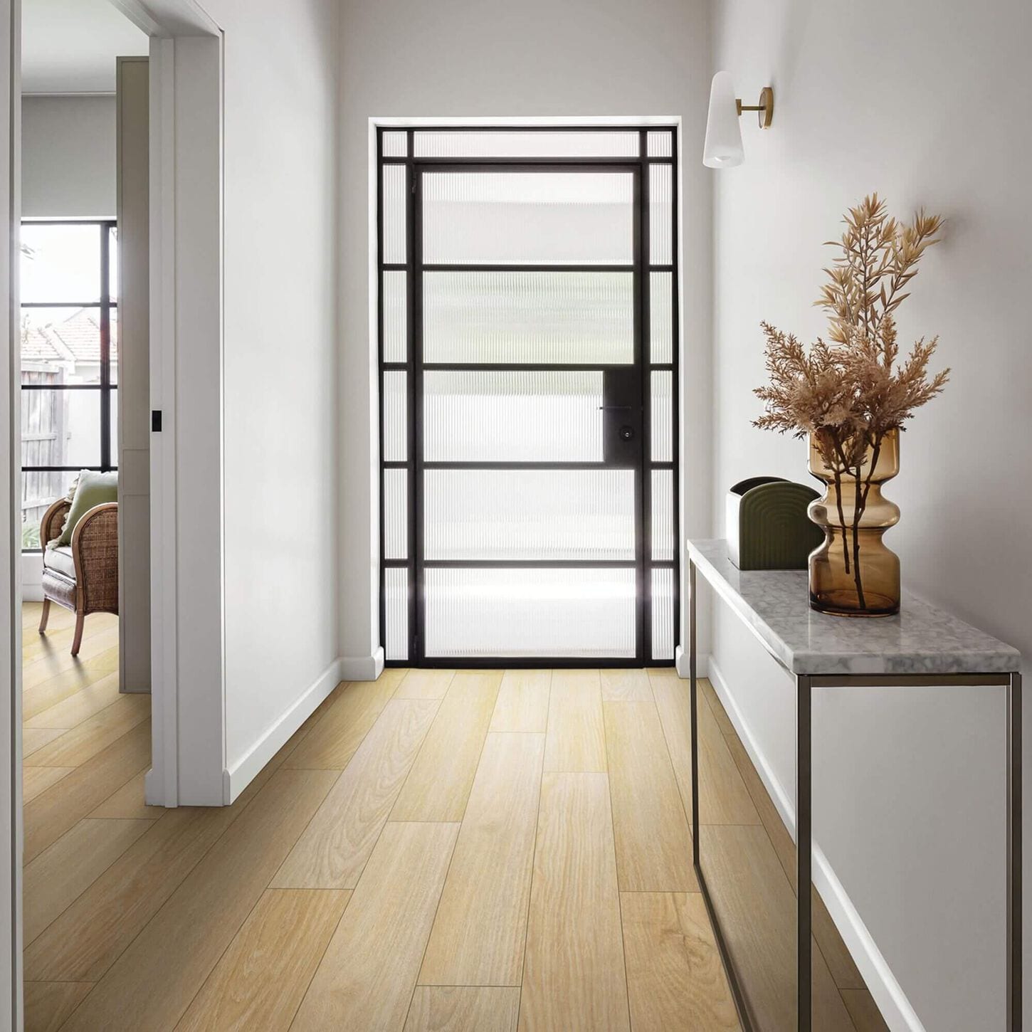 Karastan Cultivated Wood Chanterelle 7" x 48" Luxury Vinyl Tile in and entry way with a glass door