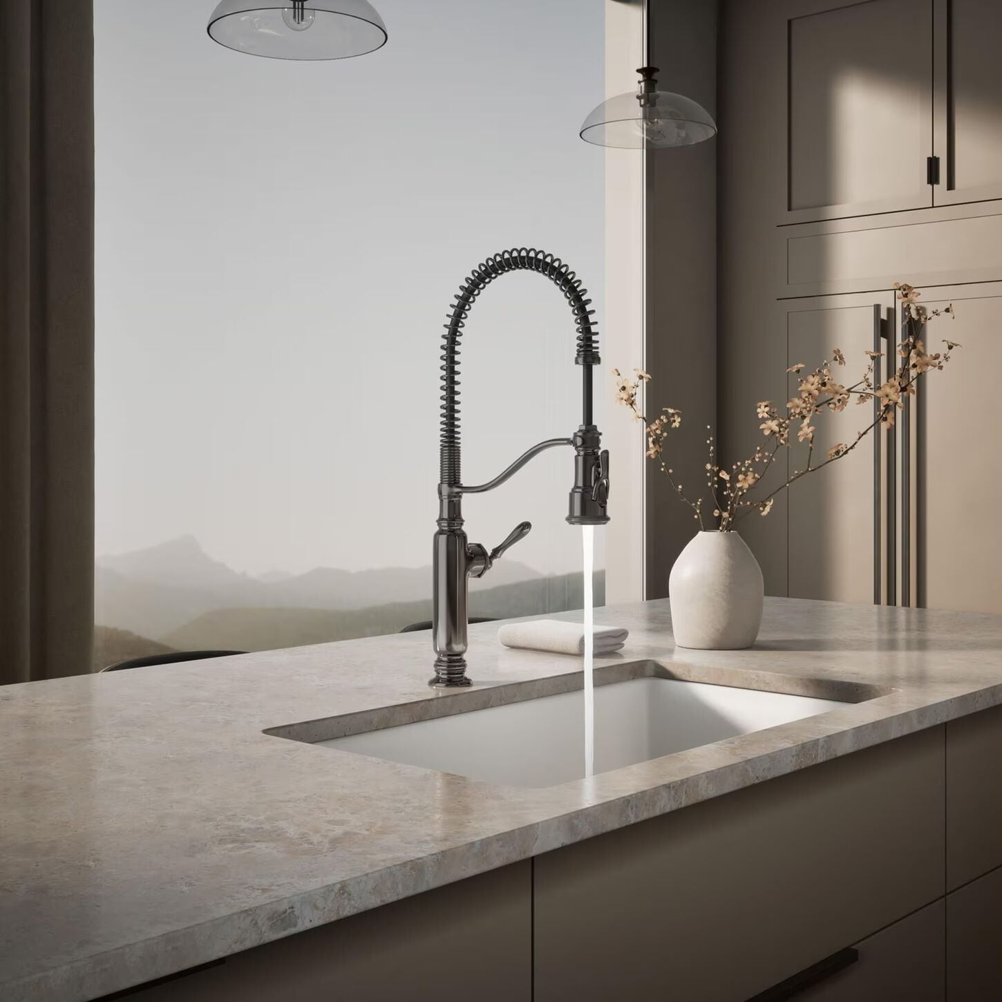 kitchen with white marbled countertop with a brushed aluminum pull down faucet