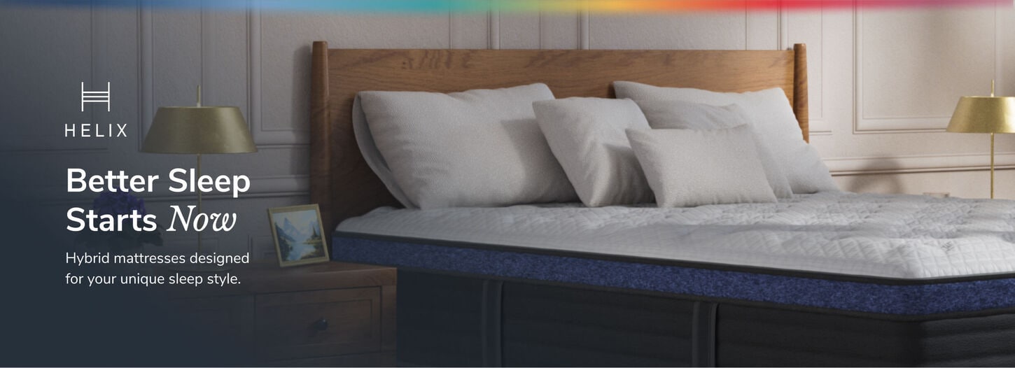 Lots of different colors shown in a room with green plants, tan credenza, pink chair and lots of colorful accents