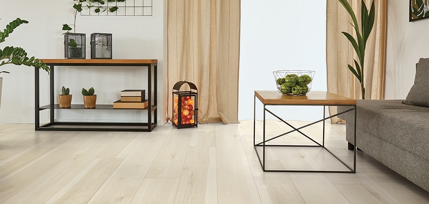 light hardwood floor with couch and tables