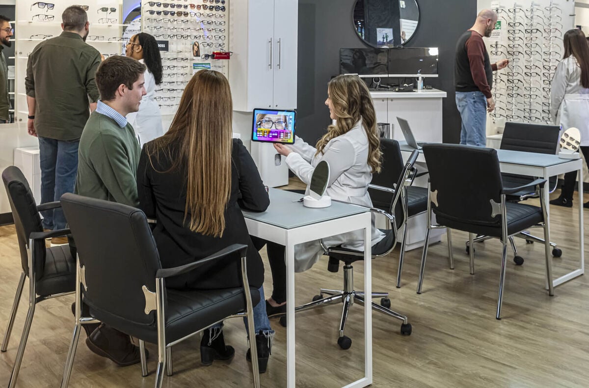 NFM Optical helping customers in store