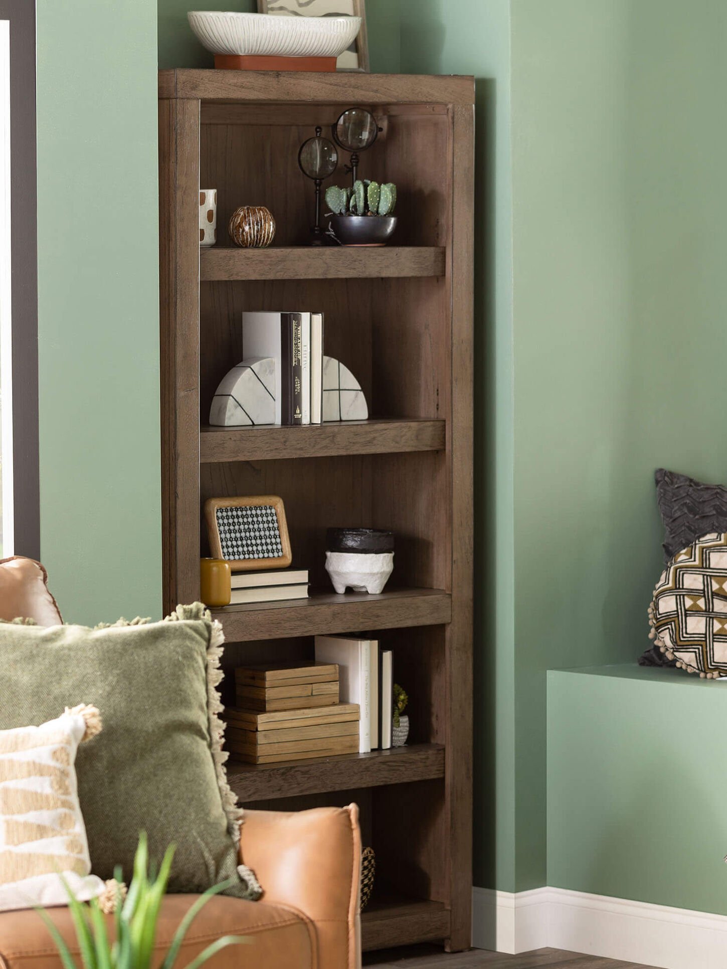 Home office with shelf and throw pillows on the chair