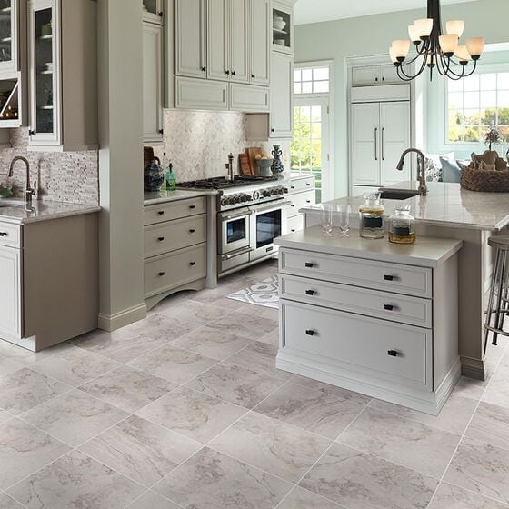 Kitchen with white cabinets and white tile floor