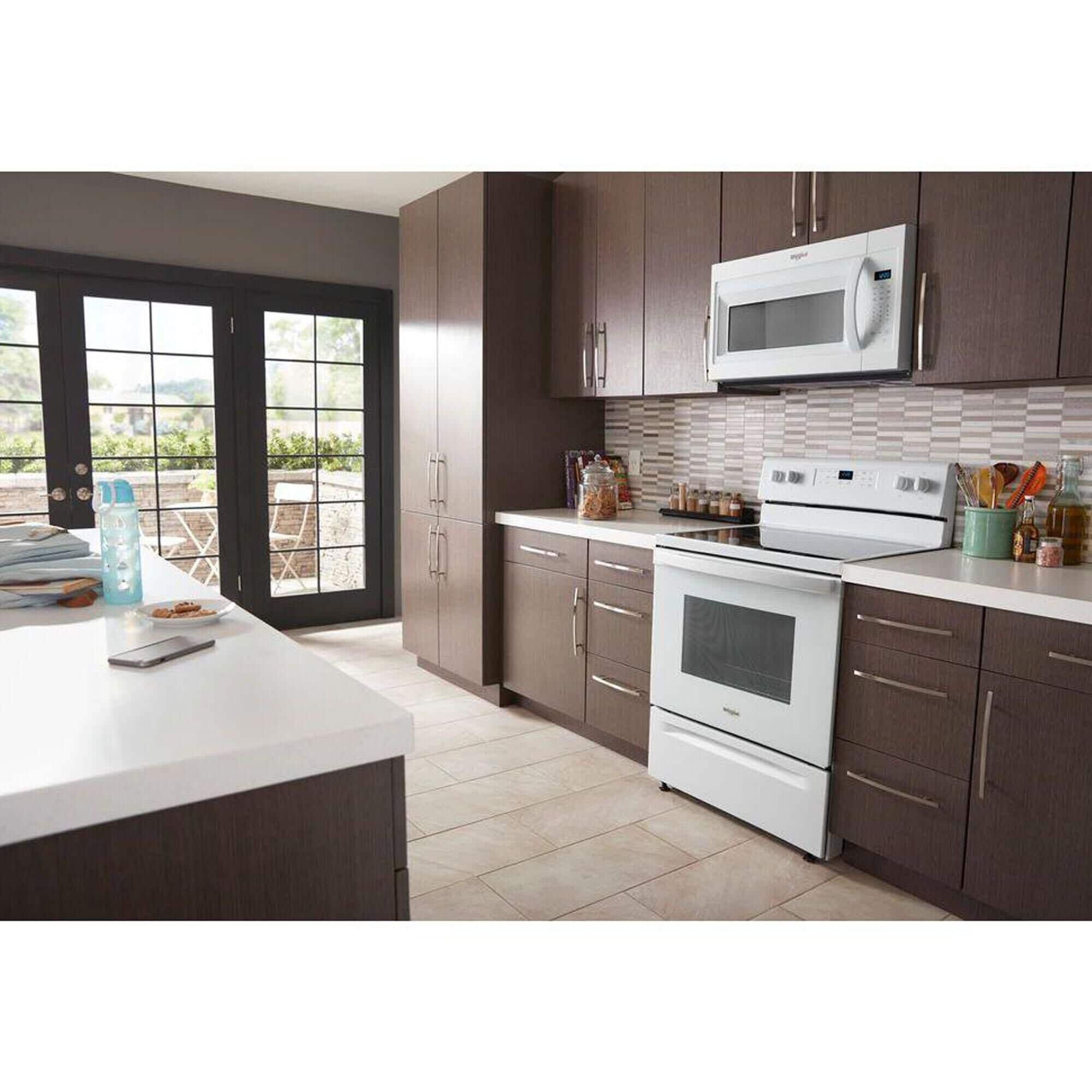 White whirlpool microwave over the sales range