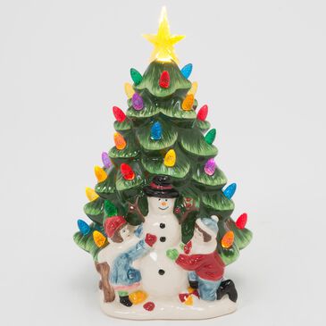 The Gerson Company 10"H Battery-Operated Lighted Ceramic Christmas Tree with Snowman and Children in Assort, , large