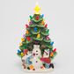 The Gerson Company 10"H Battery-Operated Lighted Ceramic Christmas Tree with Snowman and Children in Assort, , large