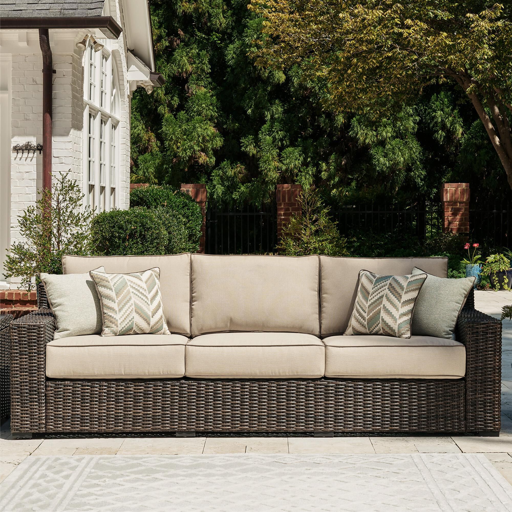 Signature Design by Ashley Coastline Bay Stationary Outdoor Sofa with Cushion in Brown NFM