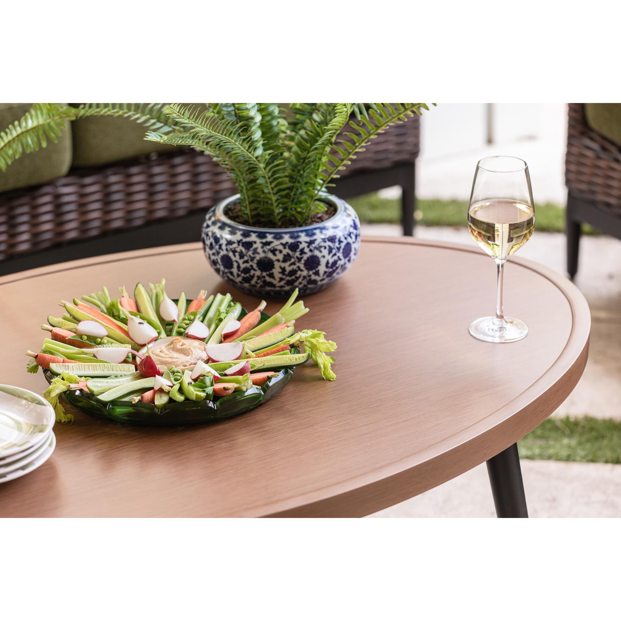 Ashley Horizon Hall Patio Oval Cocktail Table in Brown and Black