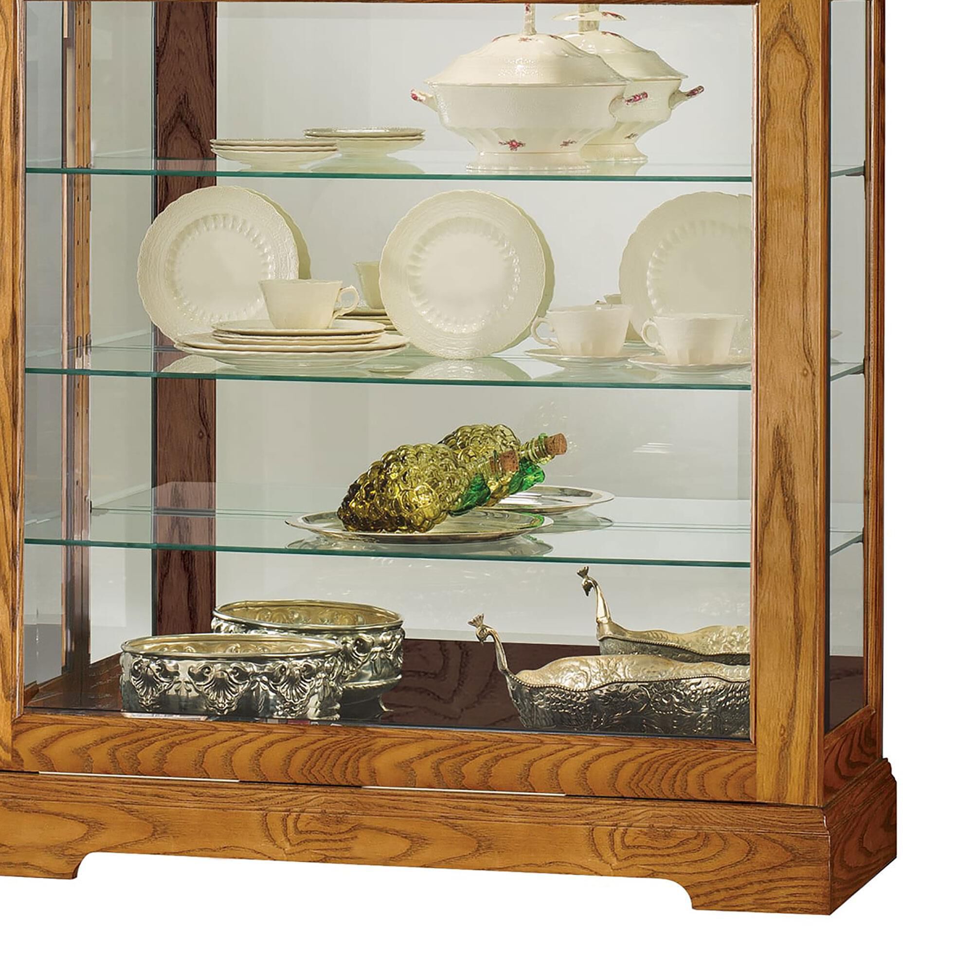 Golden oak curio cabinets top
