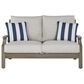 Ashley Rainier Ranch Outdoor Loveseat with Beige Cushion in Brown, , large