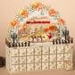The Gerson Company Lighted Laser Cut Wood Holiday Village Scene Advent Calendar in Tan, , large