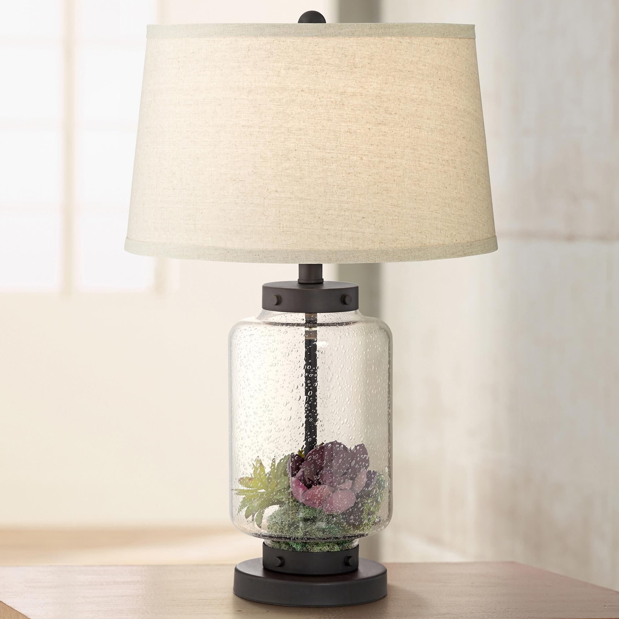 Fillable outlet table lamp