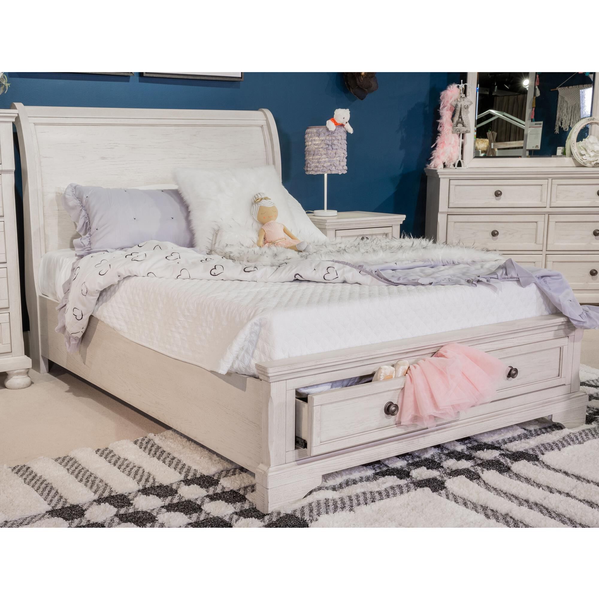 White sleigh shop bed with drawers