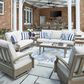 Ashley Rainier Ranch Patio Rectangular Cocktail Table in Brown and Beige, , large