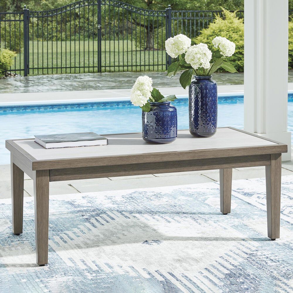 Ashley Rainier Ranch Patio Rectangular Cocktail Table in Brown and Beige, , large