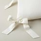 Peacock Alley Caitlin Oblong Bow Pillow in Pearl, , large