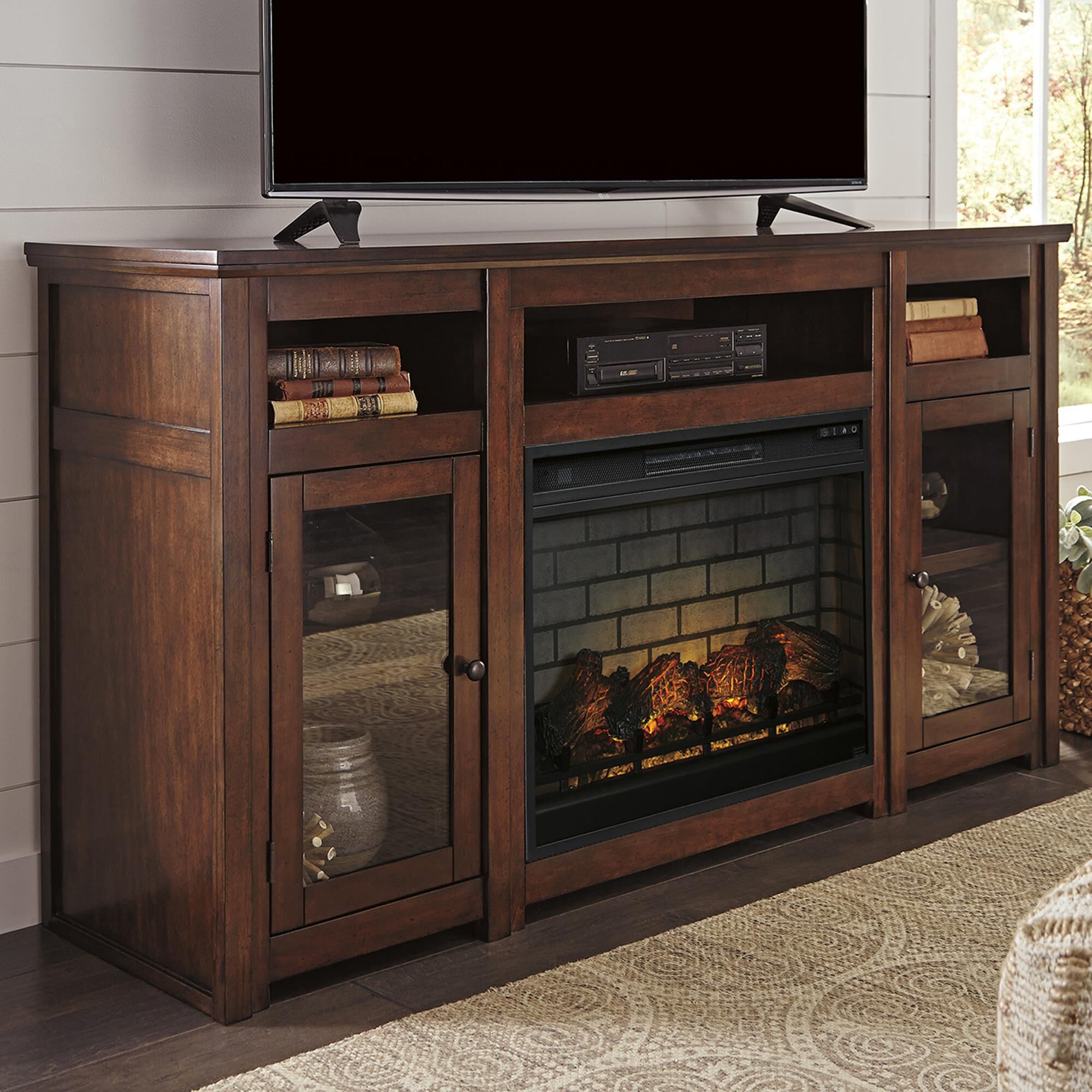 Ashley Harpan 72 TV Stand with Electric Fireplace Insert in Reddish Brown