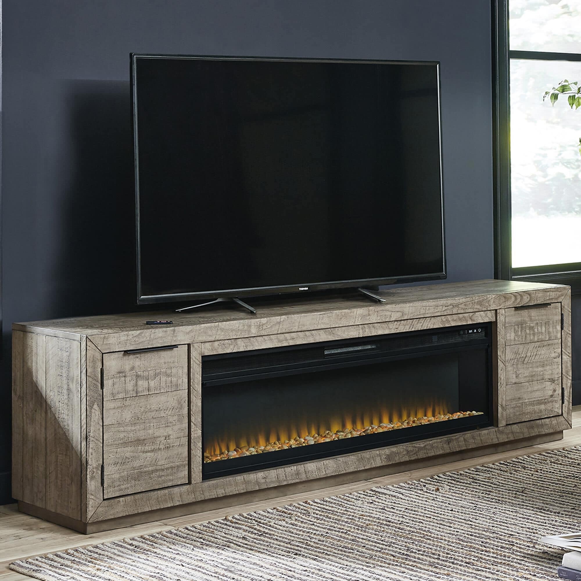 Ashley Krystanza 92 TV Stand with Electric Fireplace in Weathered Gray