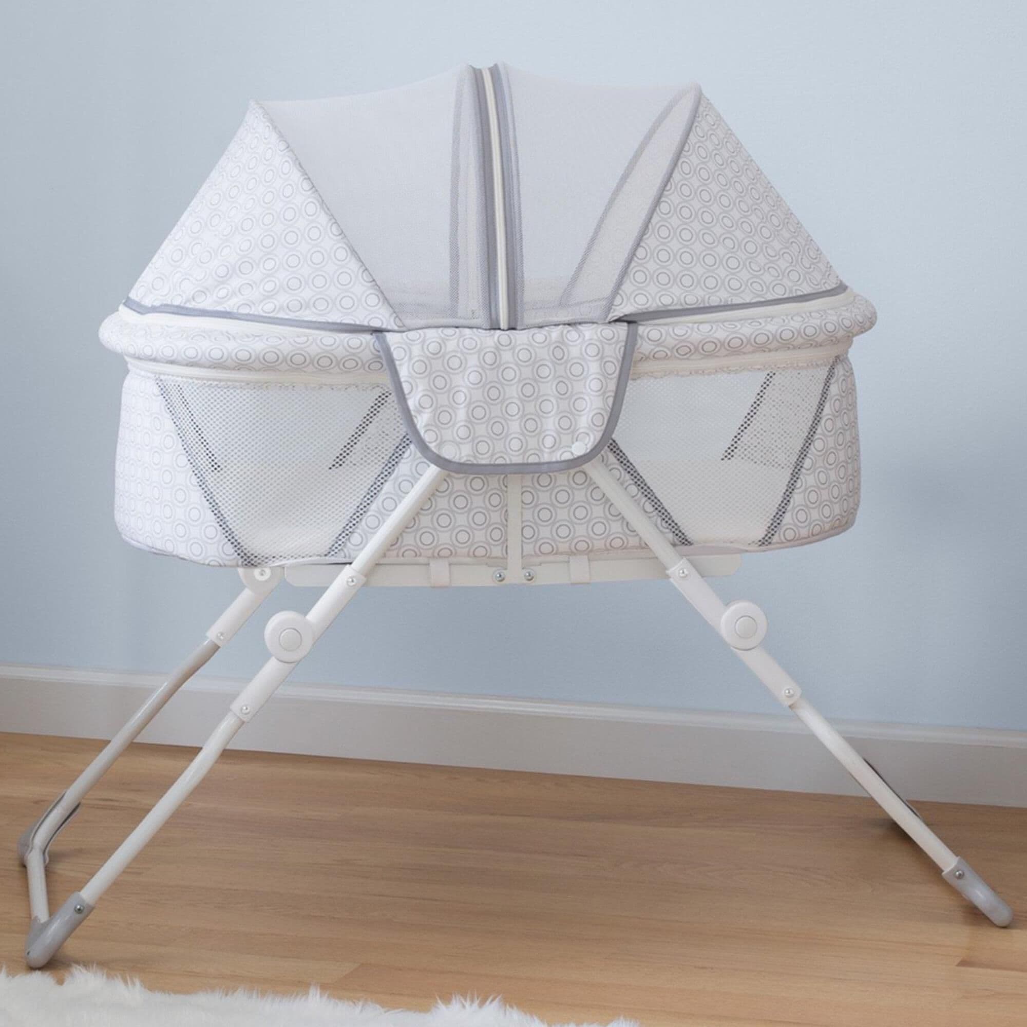 Compact online travel bassinet