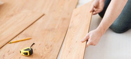 Wooden floor being installed in home
