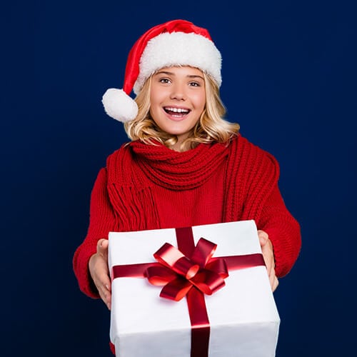 Teen Girl with gift on blue background