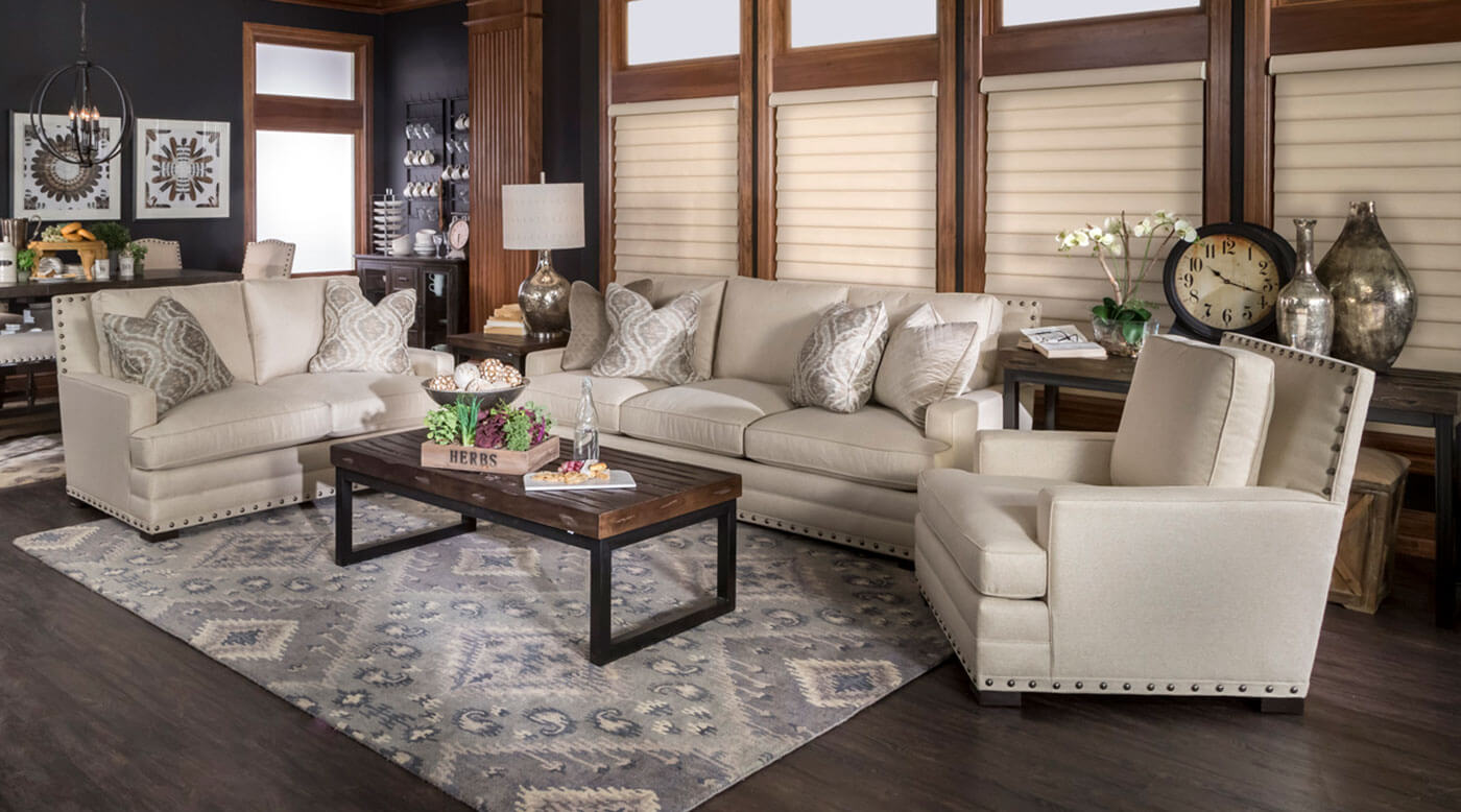 Living room with light fabric blinds and wooden paneling