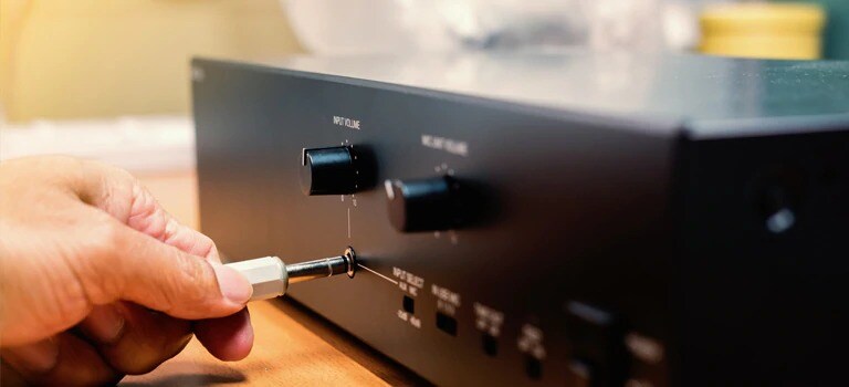 Audio ports being hooked up for audio system
