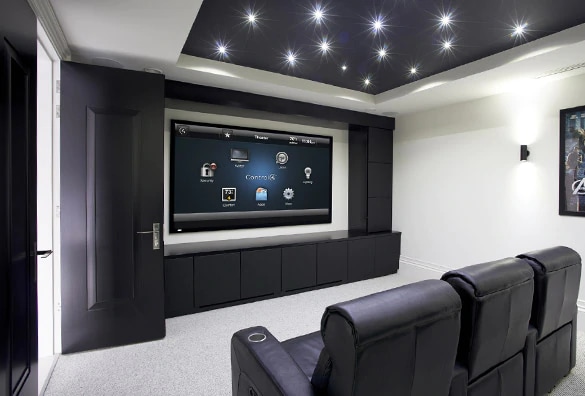 Home theater with large screen displaying multiple entertainment options