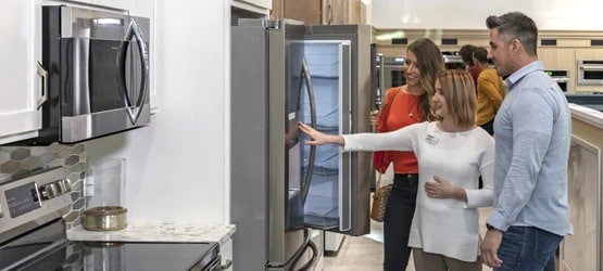 Couple shopping for new kitchen appliances