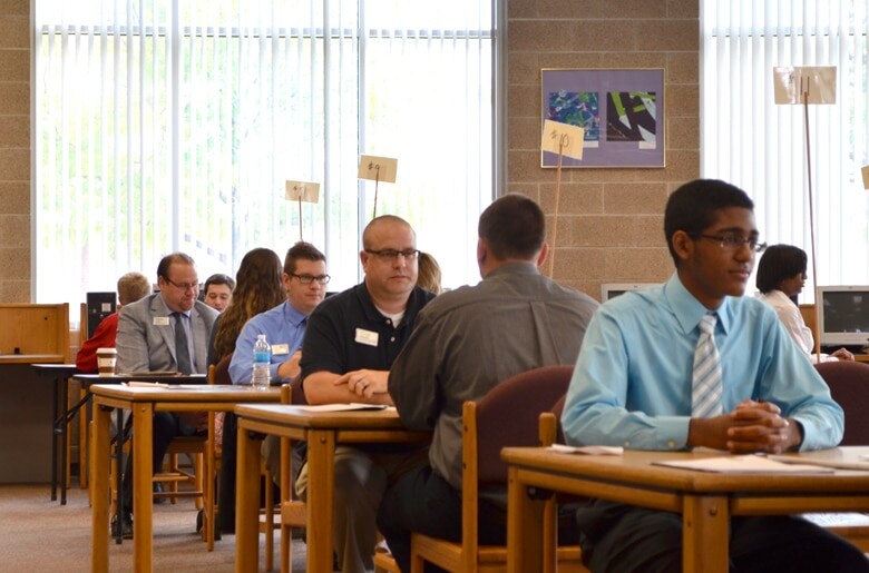 Individuals meeting with one another for education details